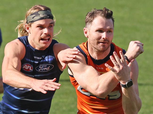 Bailey Smith has Patrick Dangerfield in his sights at Cats training. Picture: Alison Wynd