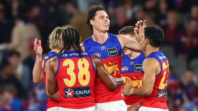 MELBOURNE, AUSTRALIA – JUNE 07: Eric Hipwood of the Lions is congratulated by teammates after kicking a goal during the round 13 AFL match between Western Bulldogs and Brisbane Lions at Marvel Stadium, on June 07, 2024, in Melbourne, Australia. (Photo by Quinn Rooney/Getty Images)
