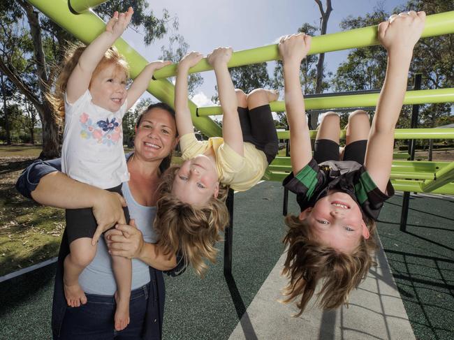 Everton Park mum of three Tegan Seccombe with daughters Hollie 2, Hannah 4, and Alicia 6 who will do an extra year of Kindy before they start school. Picture Lachie Millard