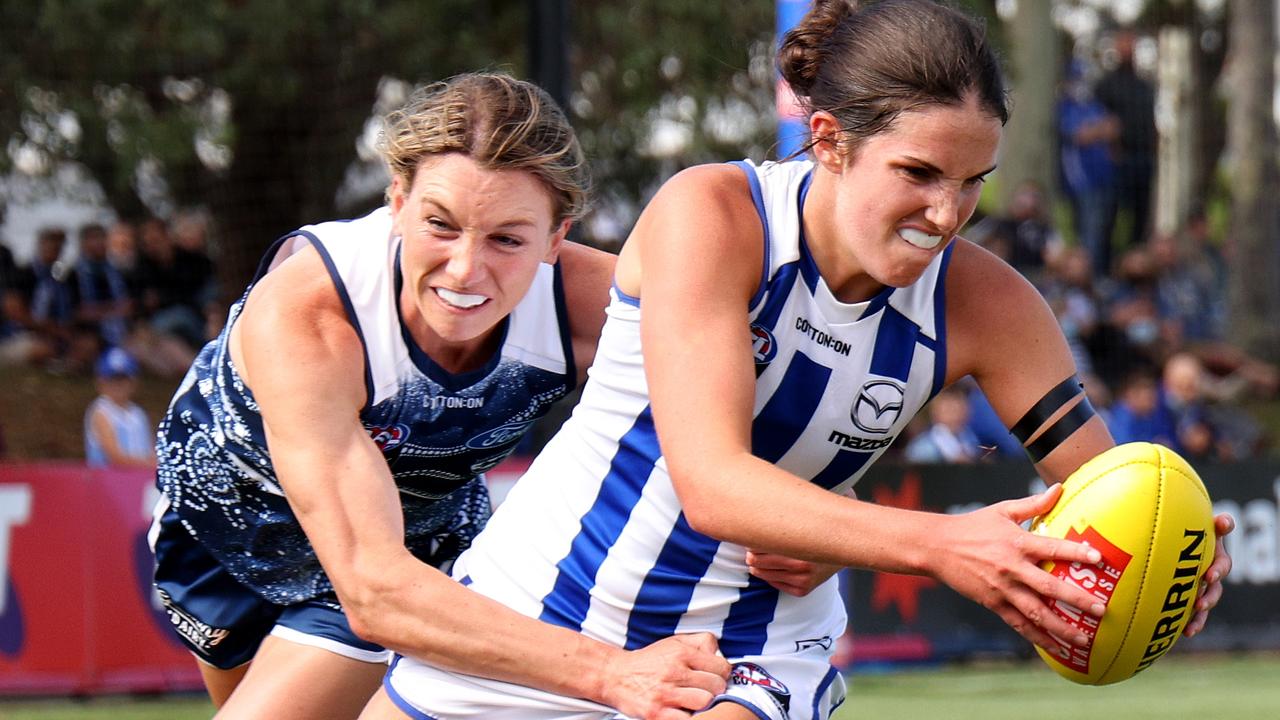 Roos starJasmine Garner tries to break the tackle. Picture: Jonathan DiMaggio