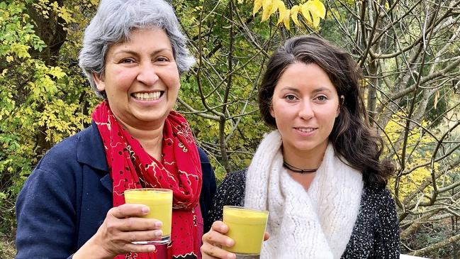 Lynette, left, and Selina Heywood with turmeric lattes laced with Golden Caramel Ghee. Picture: ELAINE REEVES