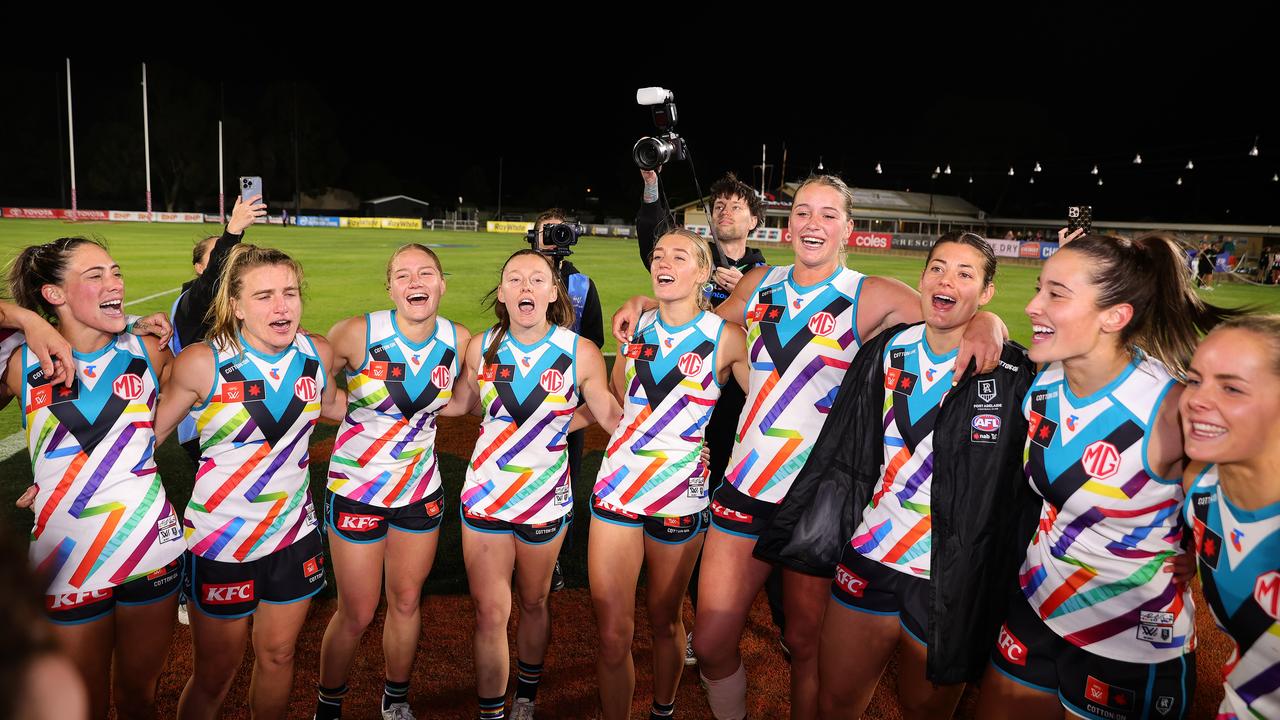 ADELAIDE, AUSTRALIA - OCTOBER 10: Port players sing the club song after the win during the 2024 AFLW Round 07 match between the Port Adelaide Power and the Collingwood Magpies at Alberton Oval on October 10, 2024 in Adelaide, Australia. (Photo by Sarah Reed/AFL Photos via Getty Images)