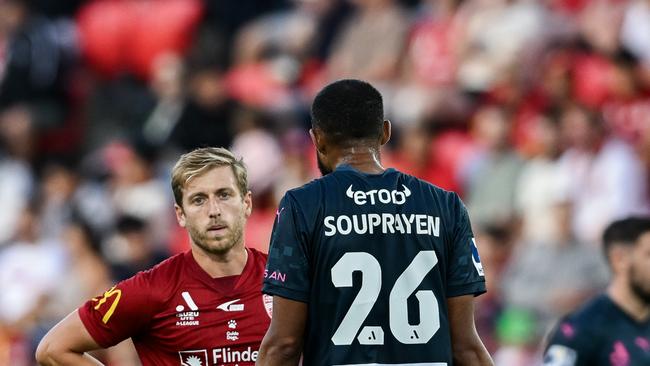 ADELAIDE, AUSTRALIA - FEBRUARY 07:  Samuel Souprayen of Melbourne City  speaks to Stefan Mauk of Adelaide United  after a tackle on Patrick Beach goalkeeper of Melbourne City during the round 18 A-League Men match between Adelaide United and Melbourne City at Coopers Stadium, on February 07, 2025, in Adelaide, Australia. (Photo by Mark Brake/Getty Images)