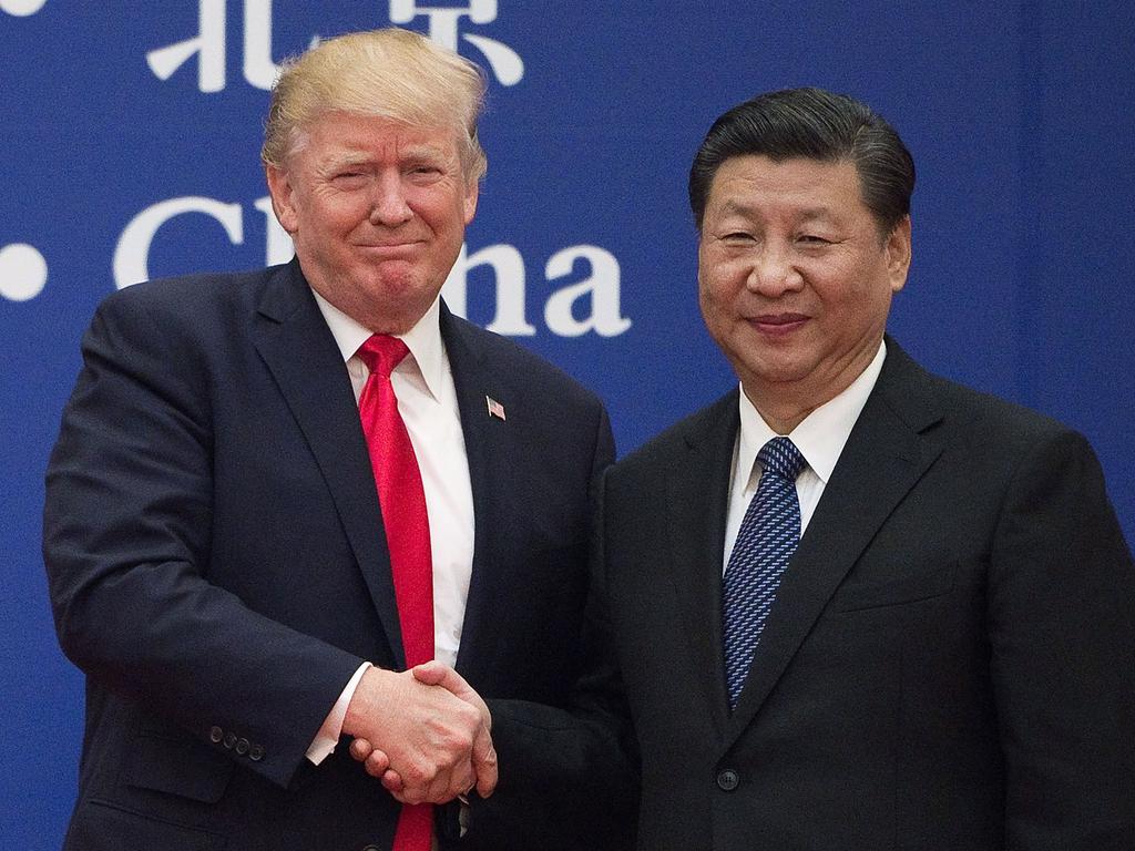 US President Donald Trump and China's President Xi Jinping shaking hands during a business leaders event in Beijing in November 2017. Trump’s trade tariff policies could make for a tense relationship. Picture: Nicolas Asfouri/AFP