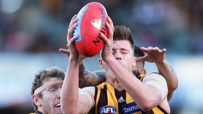 Mitch Lewis flies high to pull down a pack mark during Hawthorn’s victory. Picture: Matt King/Getty Images.