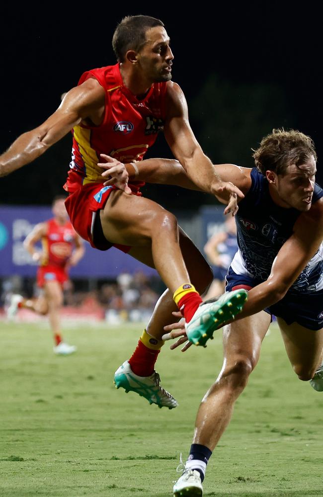 Ben Long of the Suns and Jake Kolodjashnij of the Cats in action during the 2024 AFL Round 10 match between The Gold Coast SUNS and The Geelong Cats at TIO Stadium on May 16, 2024 in Darwin, Australia. Picture: Michael Willson/AFL Photos via Getty Images