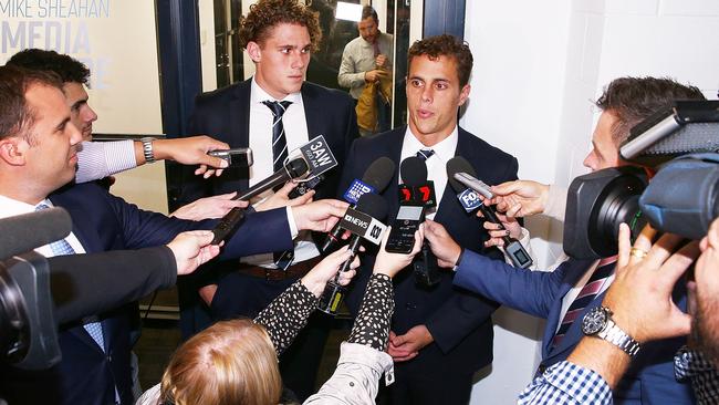 Charlie Curnow and brother Ed after being cleared of intentional contact with an umpire.