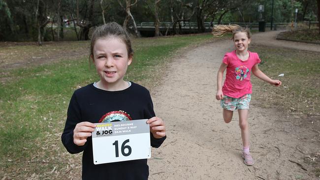 Twins Anna and Victoria, 8, will take part in the Dementia Australia Memory Walk and Jog on May 5. Picture: Ian Currie