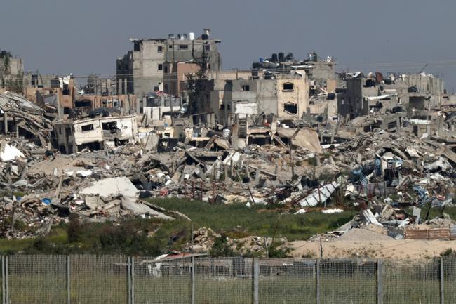 A view on March 28, 2024 from southern Israel of Gaza Strip buildings destroyed by Israeli strikes