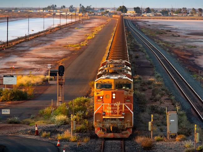 A BHP freight train carrying Australian iron ore to port. Australia ships around a third of its overall exports to China. PHOTO: IAN WALDIE/BLOOMBERG NEWS