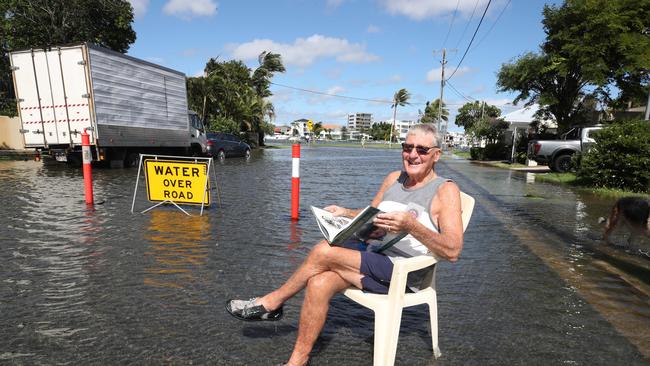 Flooding from the King tide at Budds Beach at Surfers Paradise was made worse by the approaching storm system. Local Bryan King enjoys his new waterfront vista in Palm Ave. Picture Glenn Hampson