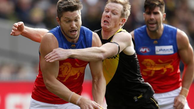 Richmond forward Jack Riewoldt lays a tackle on Lions ruckman Stefan Martin. Picture: Getty Images