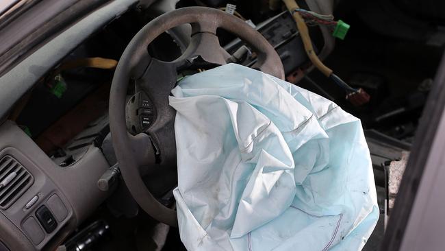 MEDLEY, FL - MAY 22: A deployed airbag is seen in a 2001 Honda Accord at the LKQ Pick Your Part salvage yard on May 22, 2015 in Medley, Florida. The largest automotive recall in history centers around the defective Takata Corp. air bags that are found in millions of vehicles that are manufactured by BMW, Chrysler, Daimler Trucks, Ford, General Motors, Honda, Mazda, Mitsubishi, Nissan, Subaru and Toyota.   Joe Raedle/Getty Images/AFP