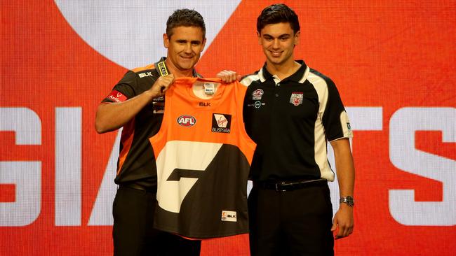 Tim Taranto is presented with a GWS guernsey by coach Leon Cameron after being taken with pick No.2. Picture: Jonathan Ng