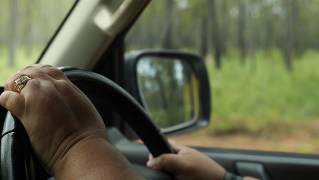 Anindilyakwa Land Council cars travel down the dirt road to the site of the Anindilyakwa Healing Centre, as part of a series of justice reforms for the Groote Archipelago. Picture: Zizi Averil