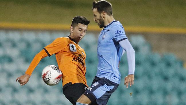 Brisbane Roar’s Rahmat Akbari (left) and Sydney FC’s Milos Ninkovic compete for the ball in their FFA Cup Round of 32 clash. Picture: Getty Images