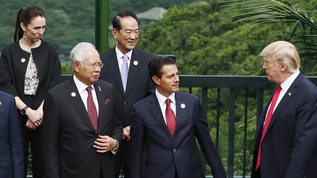 Jacinda Ardern, and Donald Trump, right, among leaders gathering for the “family photo” session at the APEC Summit in Danang, Vietnam last week. Picture: AP