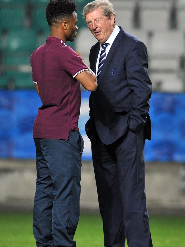 Roy Hodgson chats with Raheem Sterling.