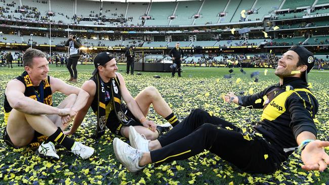 Dylan Grimes, David Astbury and Alex Rance on the MCG after Richmond’s grand final victory.