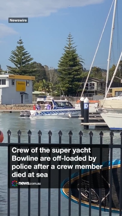 The crew of the retired super yacht Bowline are off-loaded by police