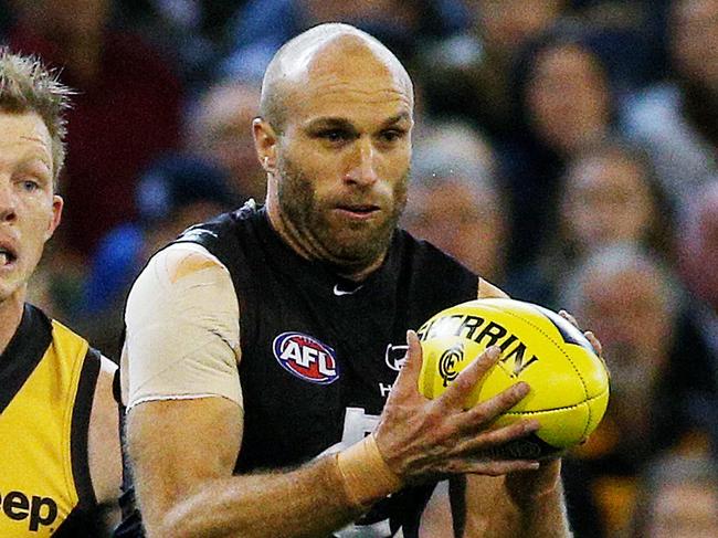 AFL Round 1 - Richmond v Carlton at MCG , Chris Judd on the run from Jack Riewoldt. 2nd April 2015. Picture: Colleen Petch.