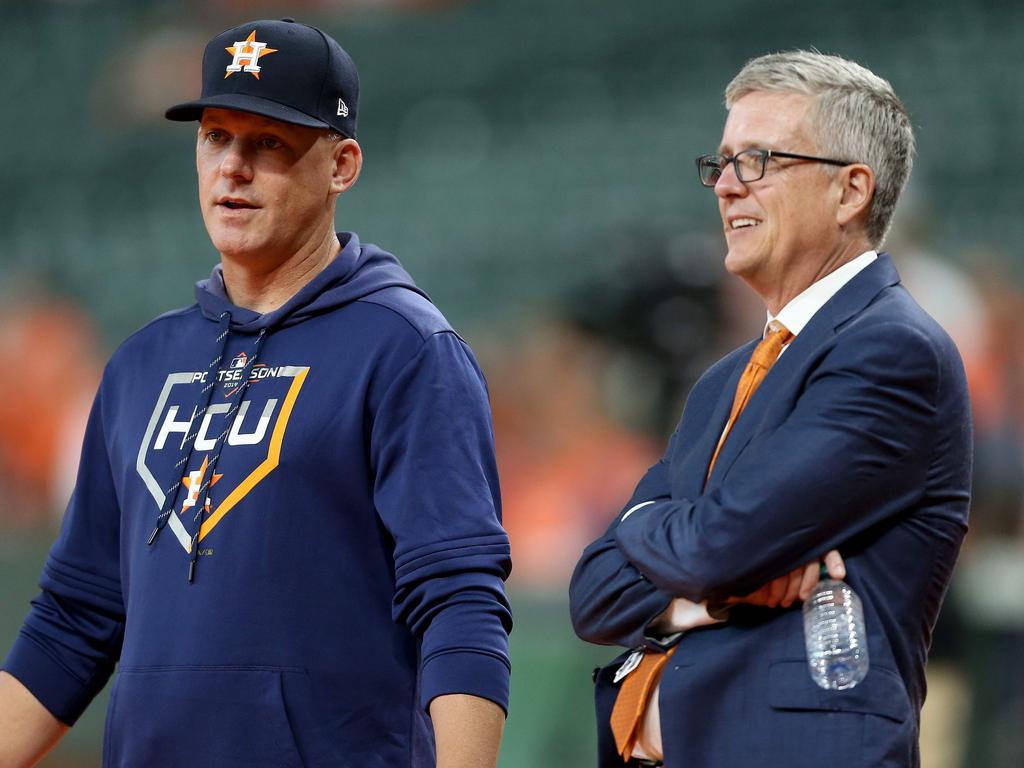 A.J. Hinch (left) and talks with Jeff Luhnow (right) have both been banned for 2020.