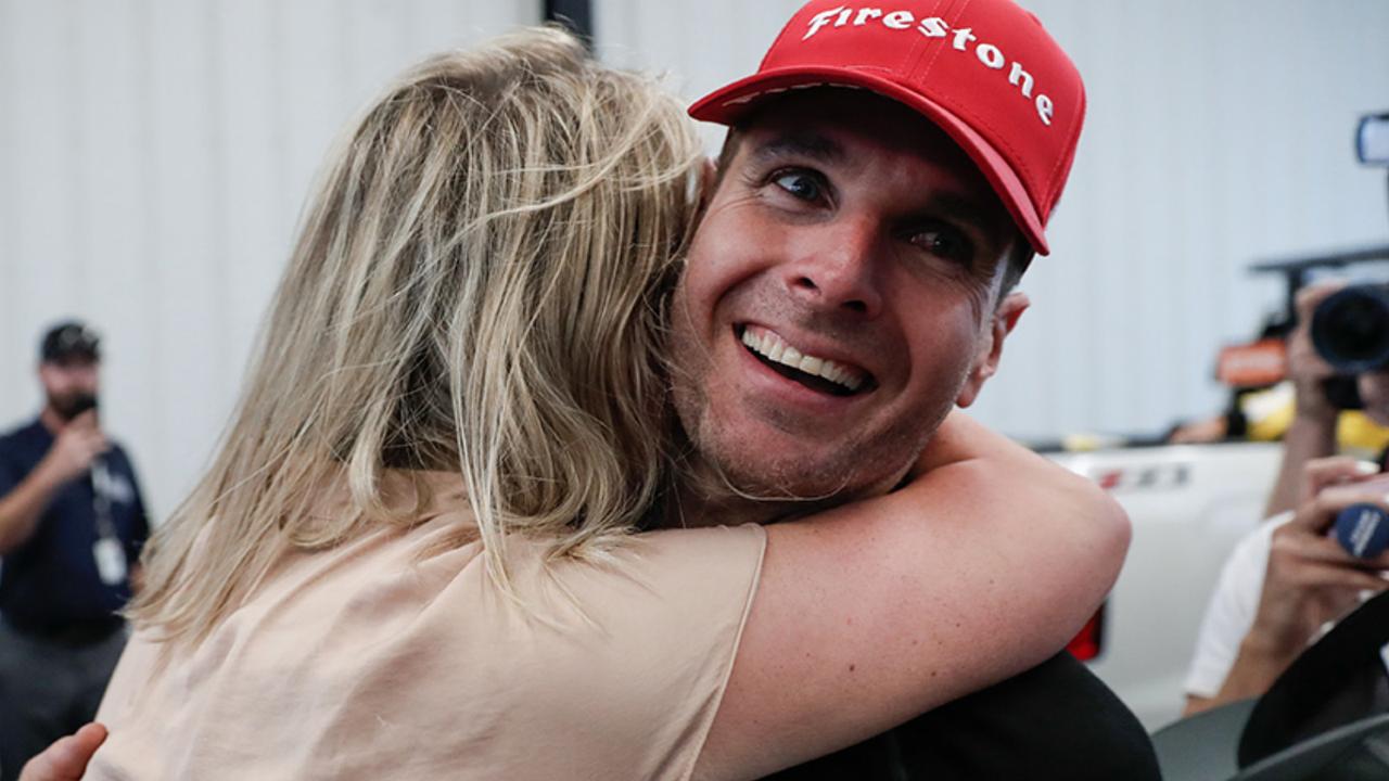 Power celebrates with wife Liz after winning at Pocono.