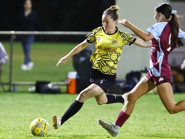 Tigers' Josephine Whately takes a shot at goal in the Football Queensland Premier League (FQPL) Far North and Gulf women's grand final match between the Edge Hill Tigers and the Redlynch Strikers, held at Endeavour Park, Manunda. Picture: Brendan Radke