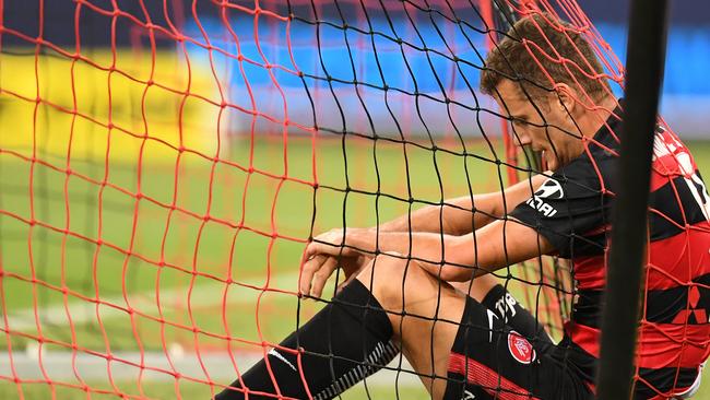 Western Sydney Wanderers striker Oriol Riera slumps in the net after missing a chance against the Newcastle Jets on Friday night. Picture: AAP