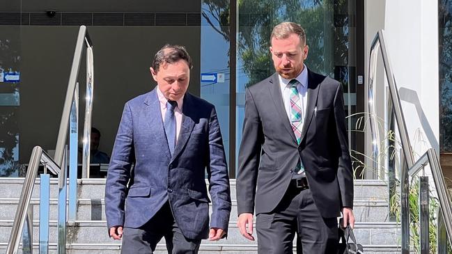 Former Kiama councillor Brendon Comber (left) leaving Wollongong Local Court with his lawyer on Friday. Picture: Dylan Arvela