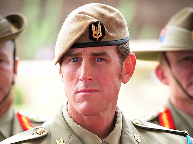 Australian Army soldier Corporal Benjamin Roberts-Smith, VC, MG, takes a seat after being awarded the Victoria Cross for Australia during the investiture ceremony in Perth on 23 January 2011. *** Local Caption *** The Governor-General of the Commonwealth of Australia held an investiture ceremony at Campbell Barracks in Perth to award a Victoria Cross for Australia to Corporal Benjamin Roberts-Smith, VC, MG, on 23 January 2011.  Corporal Benjamin Roberts-Smith, VC, MG, from the Special Air Service Regiment was awarded the Victoria Cross for Australia for his gallantry under fire during operations in Afghanistan in June 2010.    Present at the ceremony were the Governor-General of the Commonwealth of Australia, Her Excellency Ms Quentin Bryce AC; Prime Minister of Australia the Hon. Julia Gillard MP; Leader of the Opposition the Hon. Tony Abbott MP; Minister for Defence the Hon. Stephen Smith MP; Minister for Defence Science and Personnel the Hon Warren Snowdon MP; Governor of Western Australia, His Excellency Dr Ken Michael AC; Premier of Western Australia the Hon. Colin Barnett MLA; Ambassador of the Islamic Republic of Afghanistan, his Excellency Dr Amanullah Jayhoon; Member for Curtin the Hon. Julie Bishop MP; Chief of the Defence Force, Air Chief Marshal Angus Houston AC AFC; Chief of Army, Lieutenant General Ken Gillespie AO DSC CSM; and Special Operations Commander Australia, Major General Gus Gilmore DSC.  The Victoria Cross for Australia is our highest honour. It is only awarded to those who display the most conspicuous gallantry and daring in the face of the enemy. Corporal Benjamin Roberts-Smith, VC, MG, becomes the 98th Australian recipient of the award and the second recipient of the Victoria Cross for Australia since it was instituted in 1991. Picture: Department of Defence