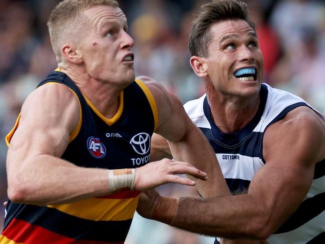 ADELAIDE, AUSTRALIA - MARCH 20: Reilly O'Brien of the Crows competes with Tom Hawkins of the Cats during the 2021 AFL Round 01 match between the Adelaide Crows and the Geelong Cats at Adelaide Oval on March 20, 2021 in Adelaide, Australia. (Photo by James Elsby/AFL Photos via Getty Images)