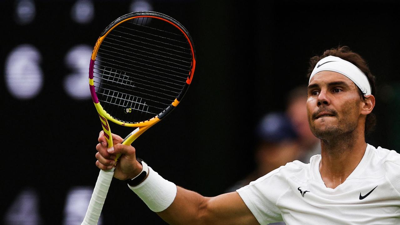 Spain's Rafael Nadal celebrates winning against Lithuania's Ricardas Berankis at the end of their men's singles tennis match on the fourth day of the 2022 Wimbledon Championships at The All England Tennis Club in Wimbledon, southwest London, on June 30, 2022. (Photo by Adrian DENNIS / AFP) / RESTRICTED TO EDITORIAL USE