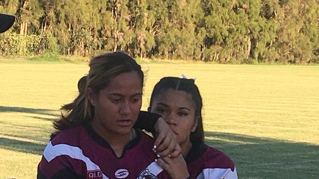 Marsden SHS players listen to Jamie Feeney's halftime address.