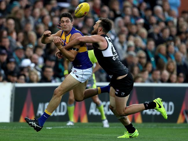 Tom Barrass of the Eagles is challenged by Charlie Dixon of the Power.