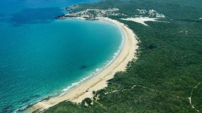 Turtle Street Beach and camping area in foreground Curtis Island.