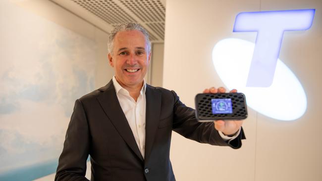 Telstra chief executive Andy Penn holds the Telstra WiFi Pro hotspot device that will be used to test mmWave 5G networks. Picture: Supplied.