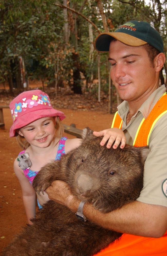 2002: Ranger Shaun Moroney shows some tourists Duncan the wombat