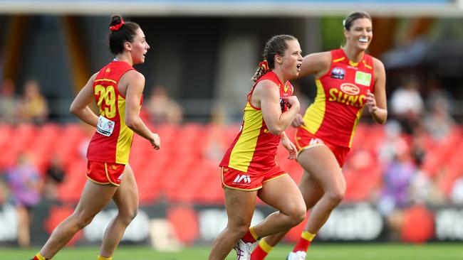 GOLD COAST, AUSTRALIA - FEBRUARY 15: Kate Surman of the Suns celebrates a goal during the round 2 AFLW match between the Gold Coast Suns and the Richmond Tigers at Metricon Stadium on February 15, 2020 in Gold Coast, Australia. (Photo by Chris Hyde/AFL Photos/Getty Images)