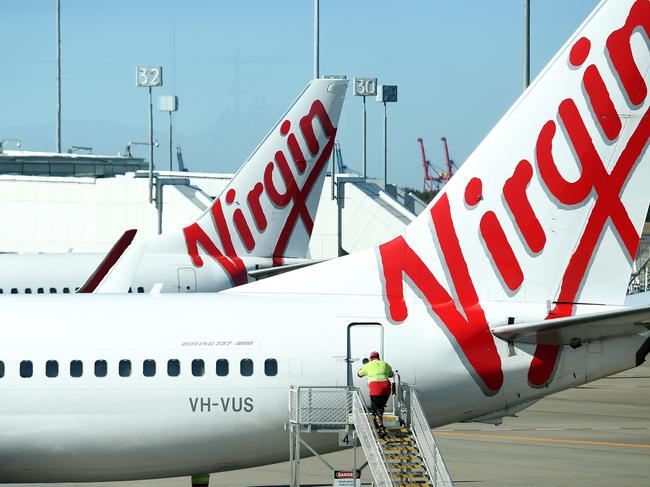 A stock image of Virgin Australia aircrafts at Brisbane Airport, Brisbane, Wednesday, August 29, 2018. Virgin Australia has today posted a full-year loss of $681 million. (AAP Image/Dan Peled) NO ARCHIVING