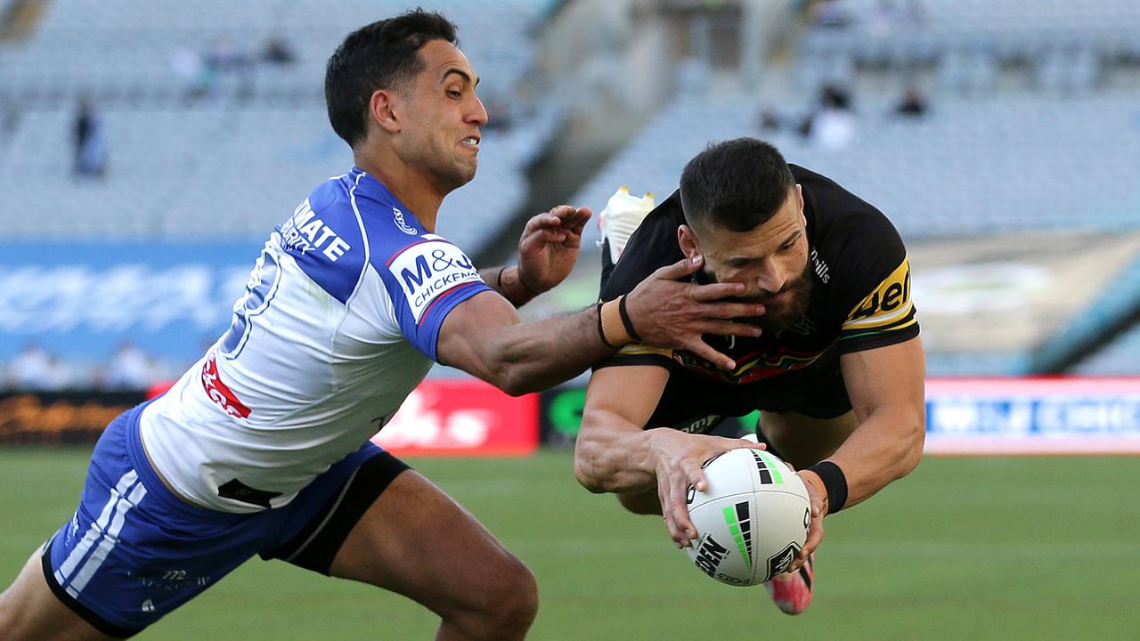 Josh Mansour of the Panthers scores a try.