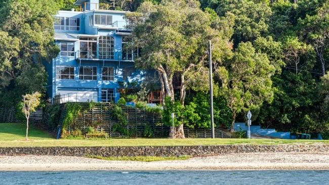 This impressive multi-level home at Shaws Bay will go up for auction.