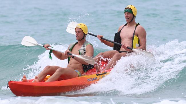 Demons in Lorne: Players kayak on the beach. Picture: Brendan Beckett