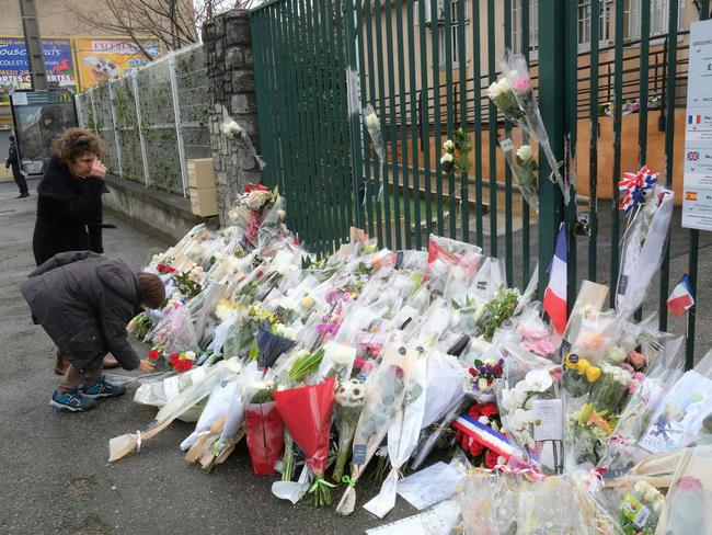 Flowers are laid outside the gendarmerie where Lieutenant-Colonel Arnaud Beltrame worked. Picture: AFP