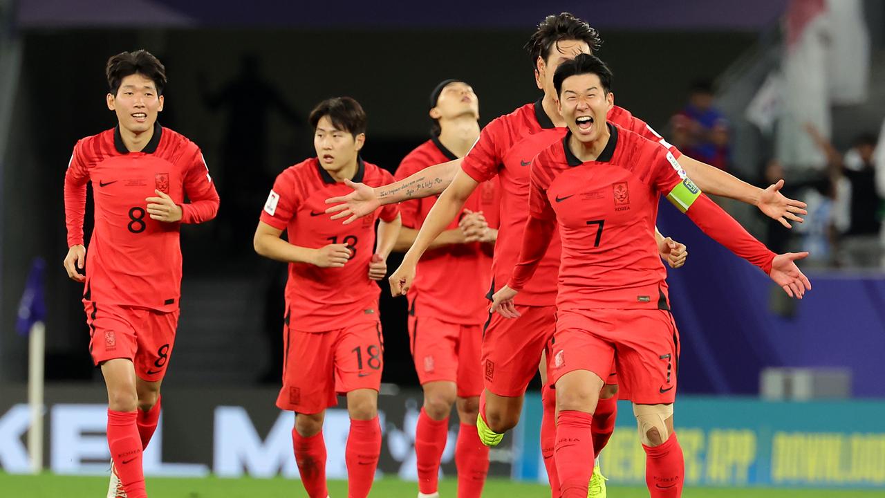 AL RAYYAN, QATAR - JANUARY 30: Son Heung-Min of South Korea and team mates celebrate victory.