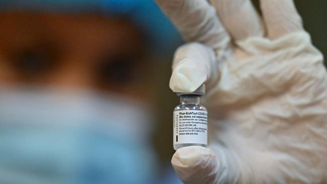 Pfizer vaccine doses must be taken three weeks apart. Picture: Luis ROBAYO / AFP