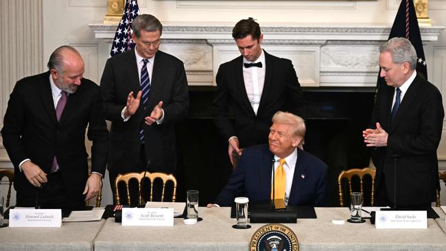 US President Donald Trump flanked by Howard Lutnick, Scott Bessent, David Sacks at a White House Crypto Summit in Washington last week. Picture: AFP