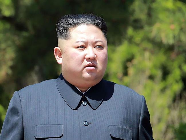 (FILES) This file picture from North Korea's official Korean Central News Agency (KCNA) taken on May 8, 2018 and released on May 9 shows China's President Xi Jinping (R) walking with North Korean leader Kim Jong Un in the Chinese city of Dalian.  Dubbed a 