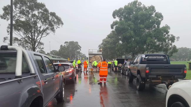 NSW Penrith SES and Penrith council volunteers are handing out sandbags from Jamison Park.