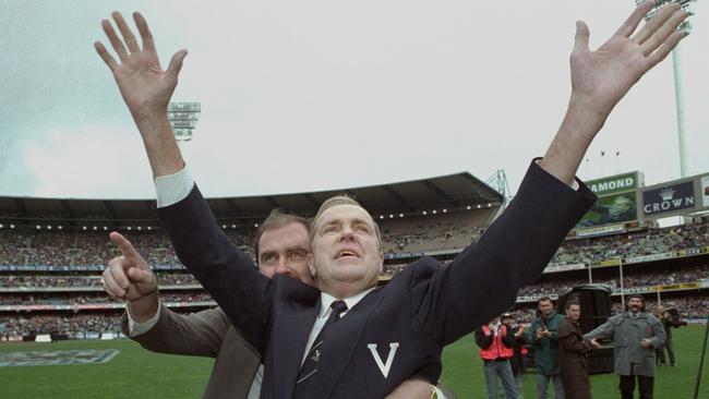 Ted Whitten with his son during a lap of honour before the State of Origin match at the MCG.